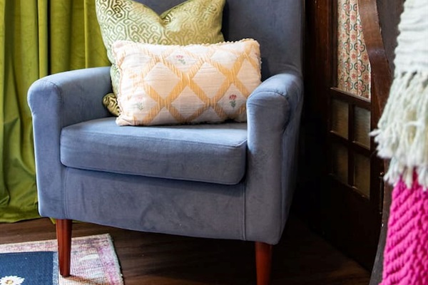 Bright and spacious living room featuring a comfortable sofa bed, perfect for relaxing or accommodating extra guests.