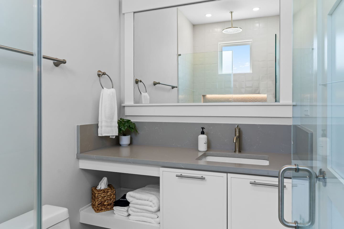 Thoughtful touches make every stay easier. This private en-suite bathroom comes stocked with essentials like hand soap, makeup cloths, tissues, and more.