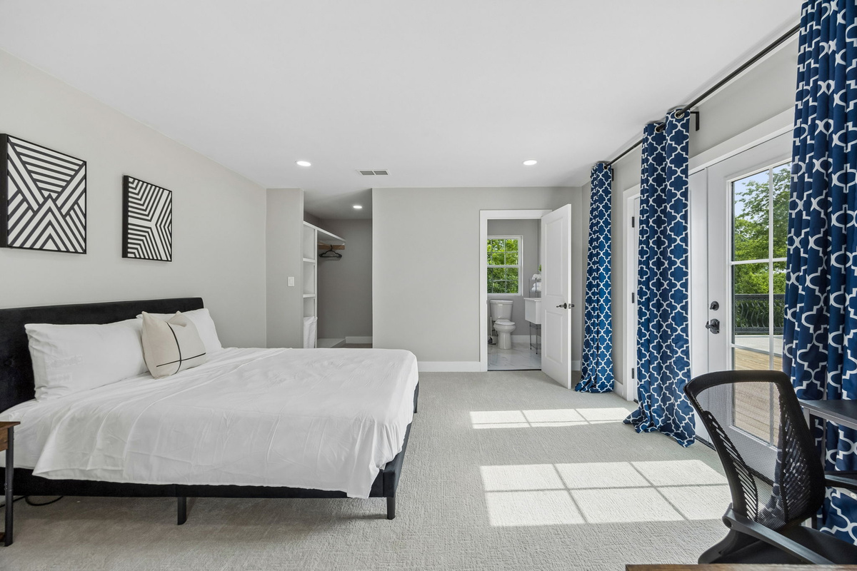Beautifully designed queen bedroom offering comfort, privacy, and a relaxing place to unwind.