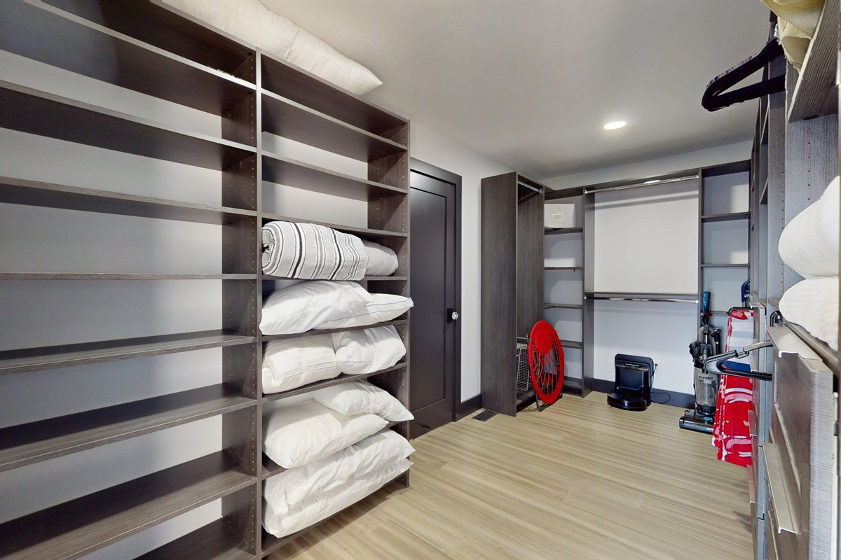 Large closet off Primary Bedroom with extra pilows and bedding. Two blow-up air mattresses located in this closet.