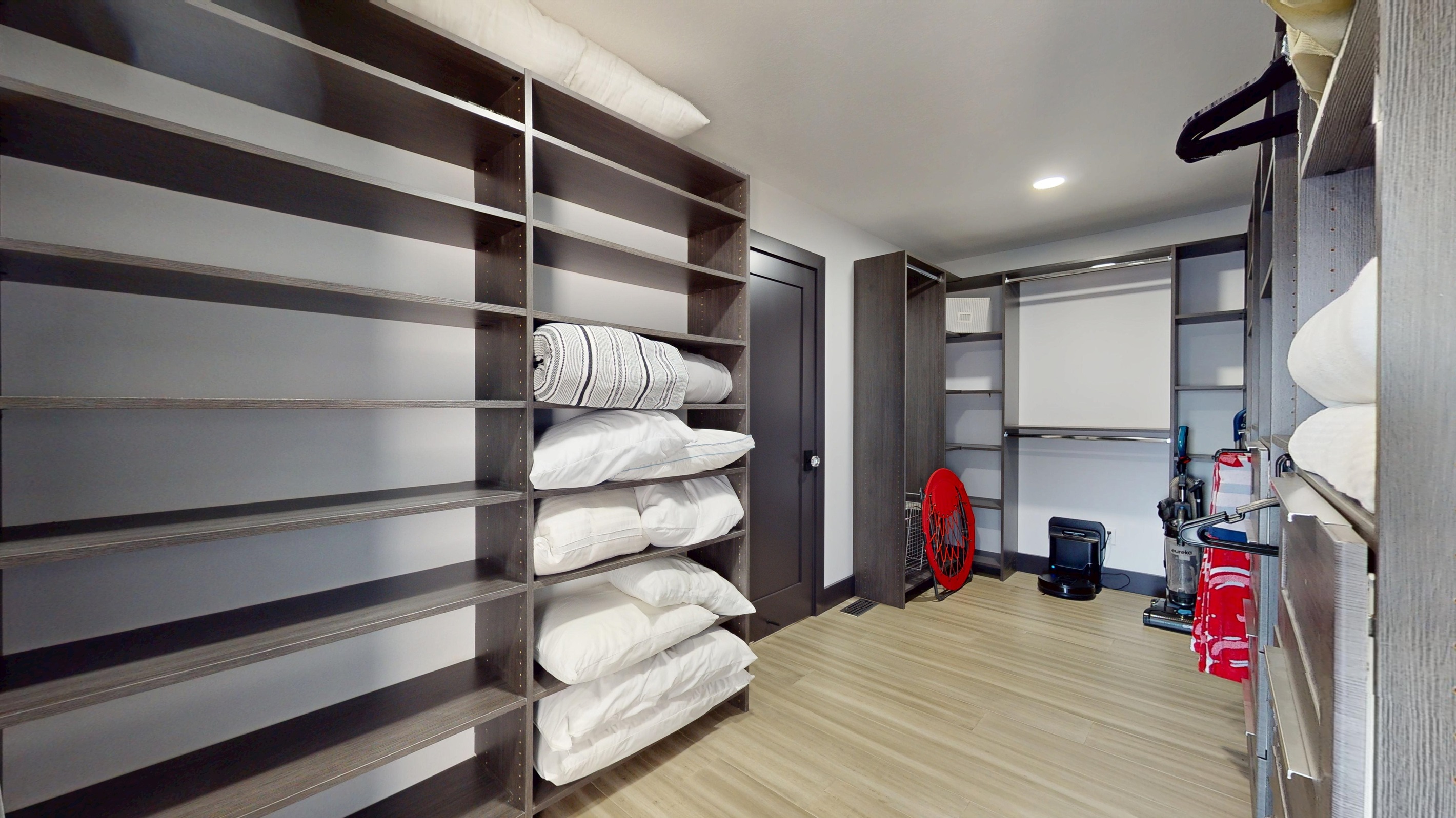 Large closet off Primary Bedroom with extra pilows and bedding. Two blow-up air mattresses located in this closet.