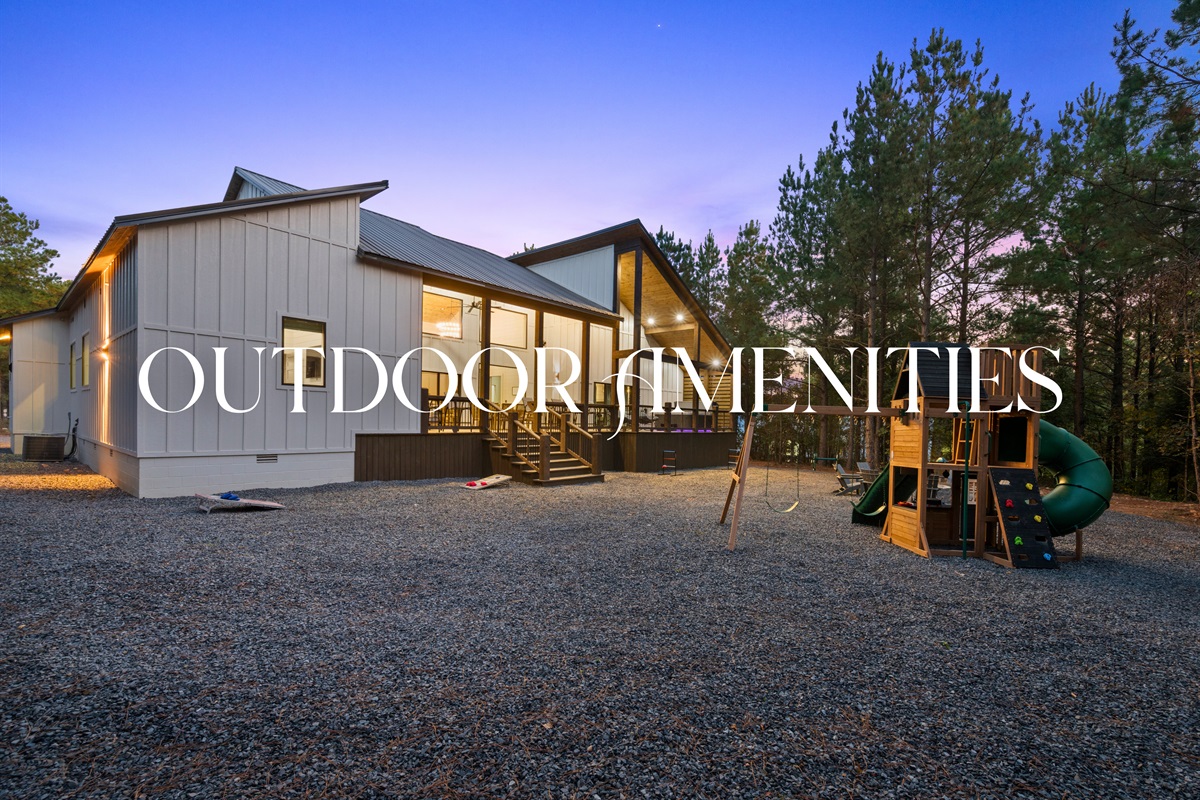 The outdoor amenities include everything for a fun-filled stay—from the kids’ playset and grill to the fire pit and open-air games.