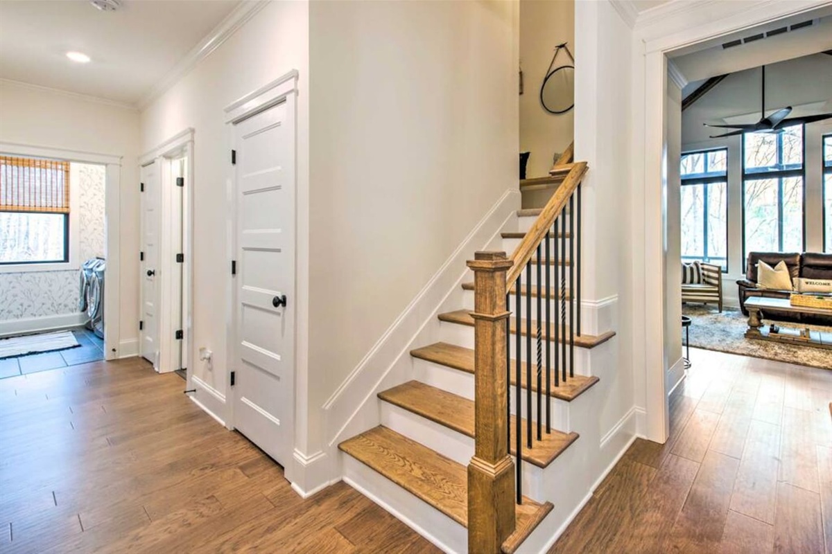 Stairs leading to upstairs bedroom and bathroom