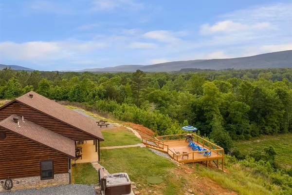 Wraparound deck and hot tub overlooking the valley and river below.