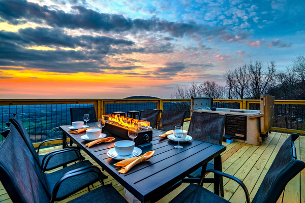 Firepit table to set the mood, complete with a sweeping sky showing off its golden rays as your background! Outdoor dining at its best.
