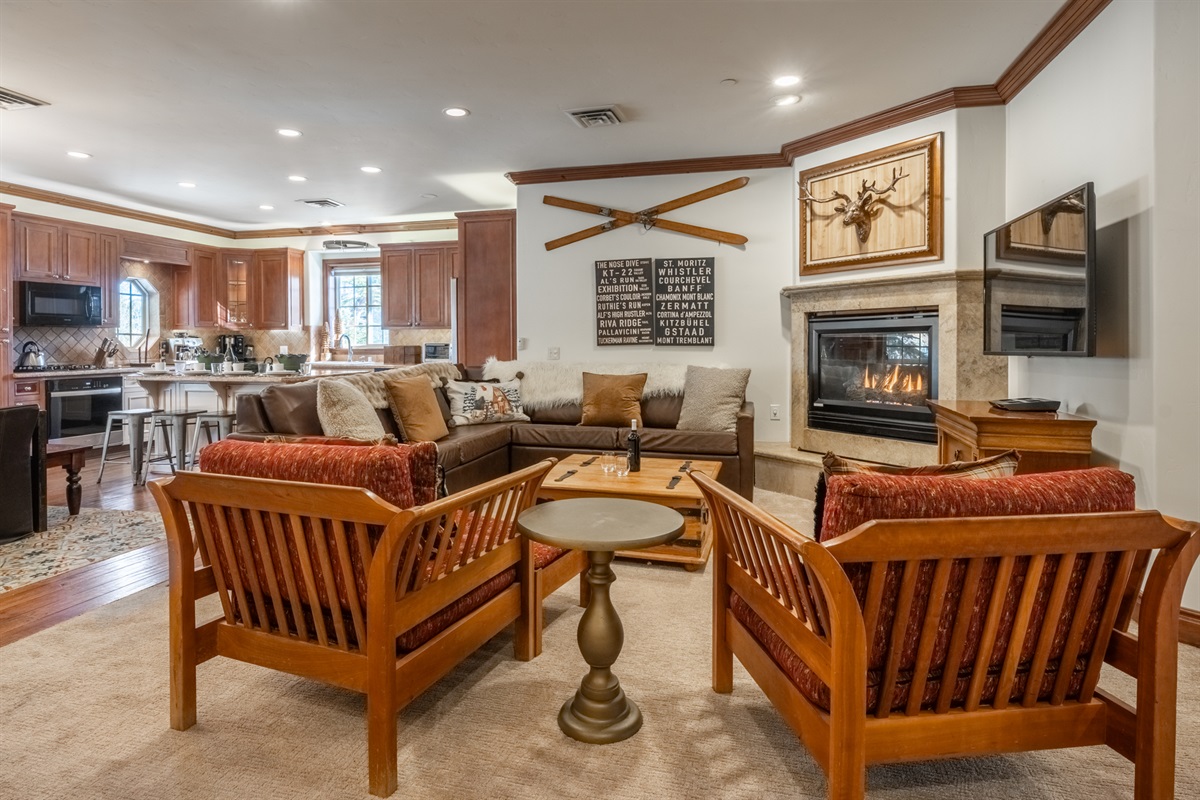 Open living area with cozy seating, fireplace, and plenty of room to relax together.