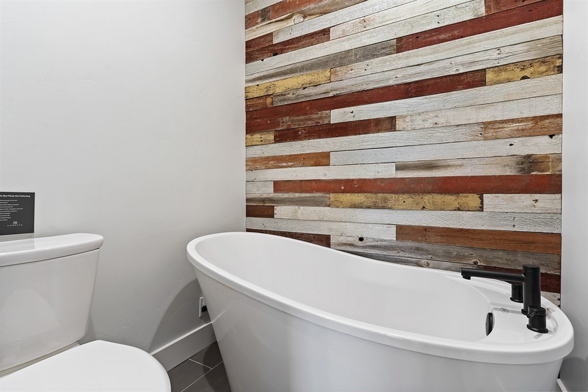 Rejuvenate in a deep soaking tub set within a beautifully designed space—your private sanctuary after a day of adventure.