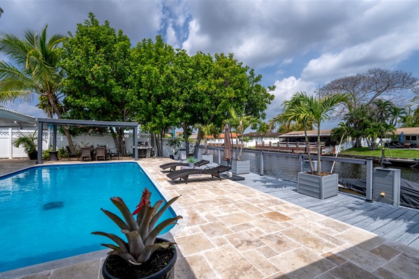 Spacious waterfront patio with heated pool & canal views