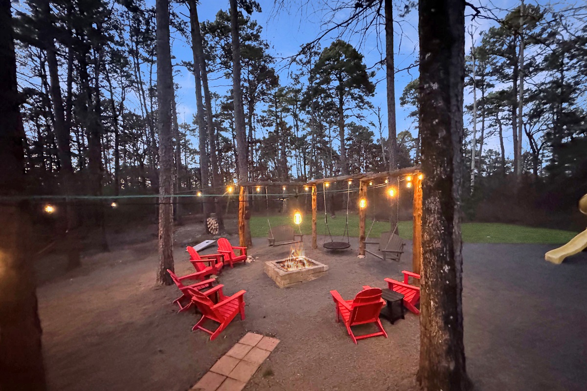 Twinkling lights, crackling fire, bubbling hot tub - pure backyard bliss.