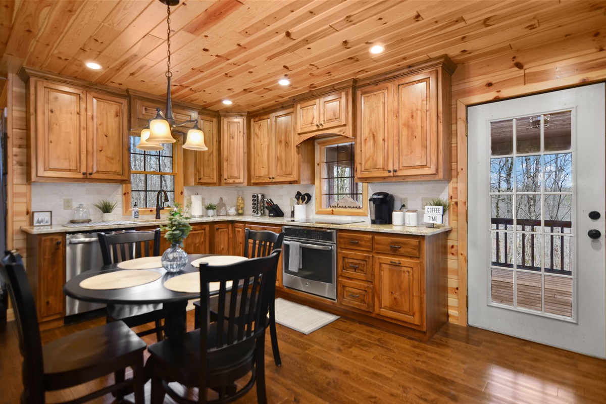 Kitchen w/ access to the back deck