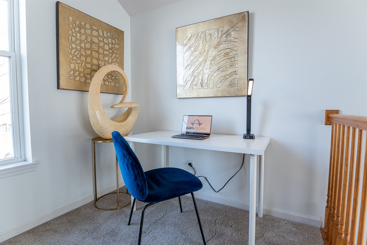 Need to plug in for a bit? This stylish desk space at the stair landing offers natural light, and the perfect spot to stay productive during your stay.