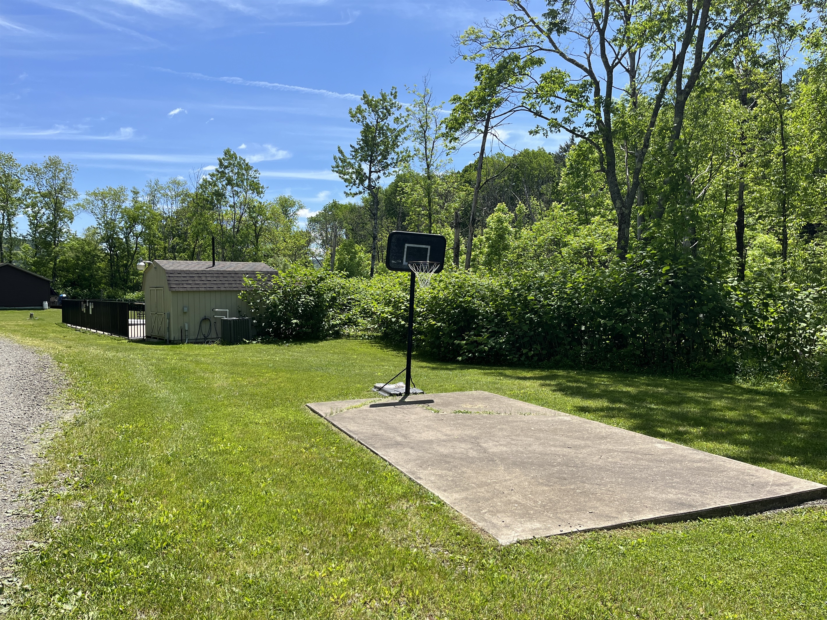 Basketball Court with pool beyond