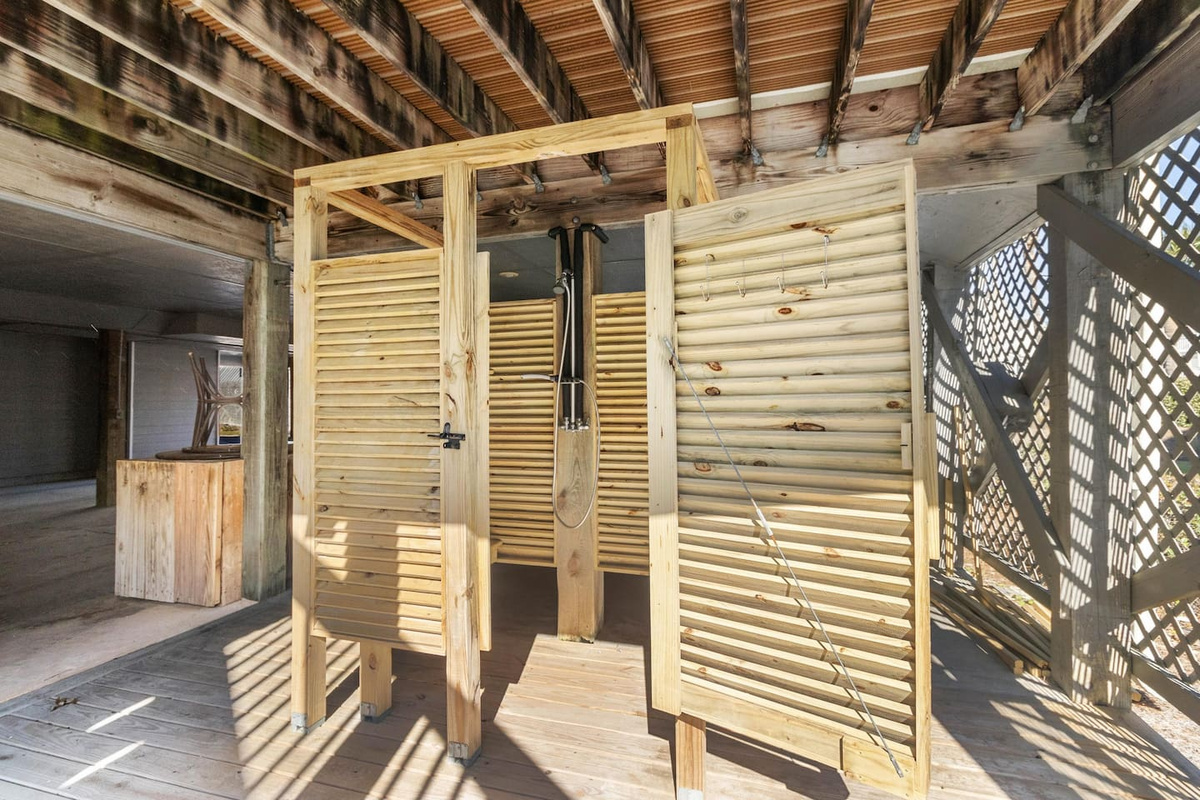 Rinse off in the outdoor shower right on the beach deck &mdash; rinse off before you come back inside. The sand stays outside where it belongs.
