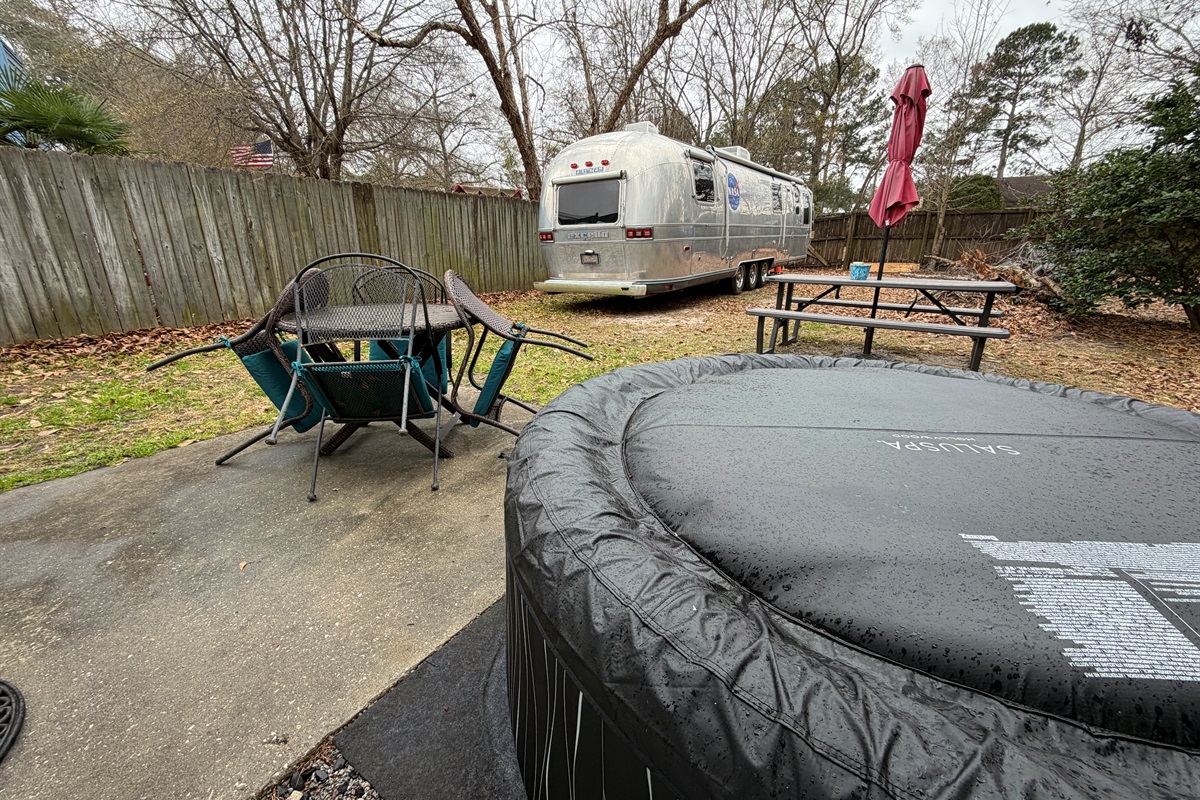 Backyard with hot tub, picnic table Note: Our Airstream RV may be parked in backyard.  It is not occupied or included.  Please do not tamper with it.  Thank you.