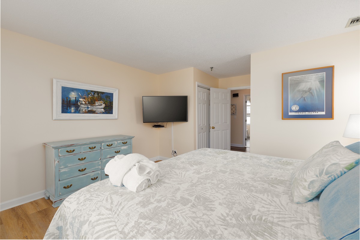 This bedroom is a delightful blend of comfort and coastal character