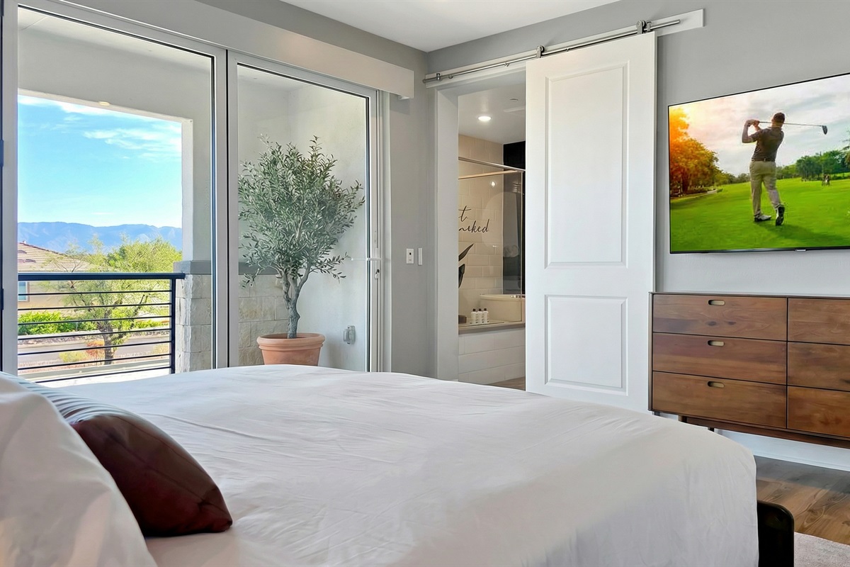 Bedroom #4 — Spacious upstairs primary suite with its own private patio overlooking stunning mountain views.