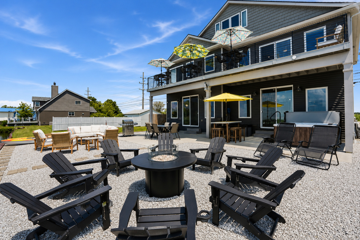Gather around the fire pit, unwind on the spacious waterfront patio, and enjoy outdoor dining, grilling, and plenty of seating—perfect for relaxing after a day on beautiful Lake St. Clair.