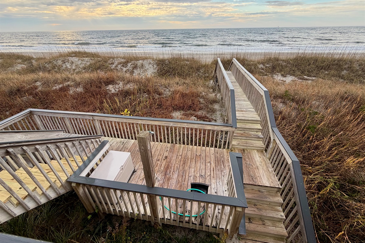 Walkway to the beach with footwash and hot/cold shower.