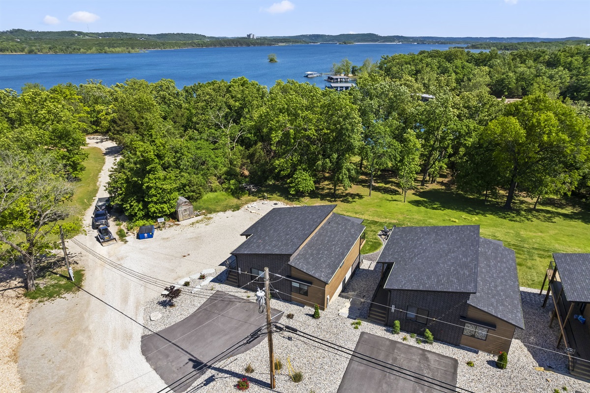 Aerial view. There are 4 identical homes that share the outdoor space.