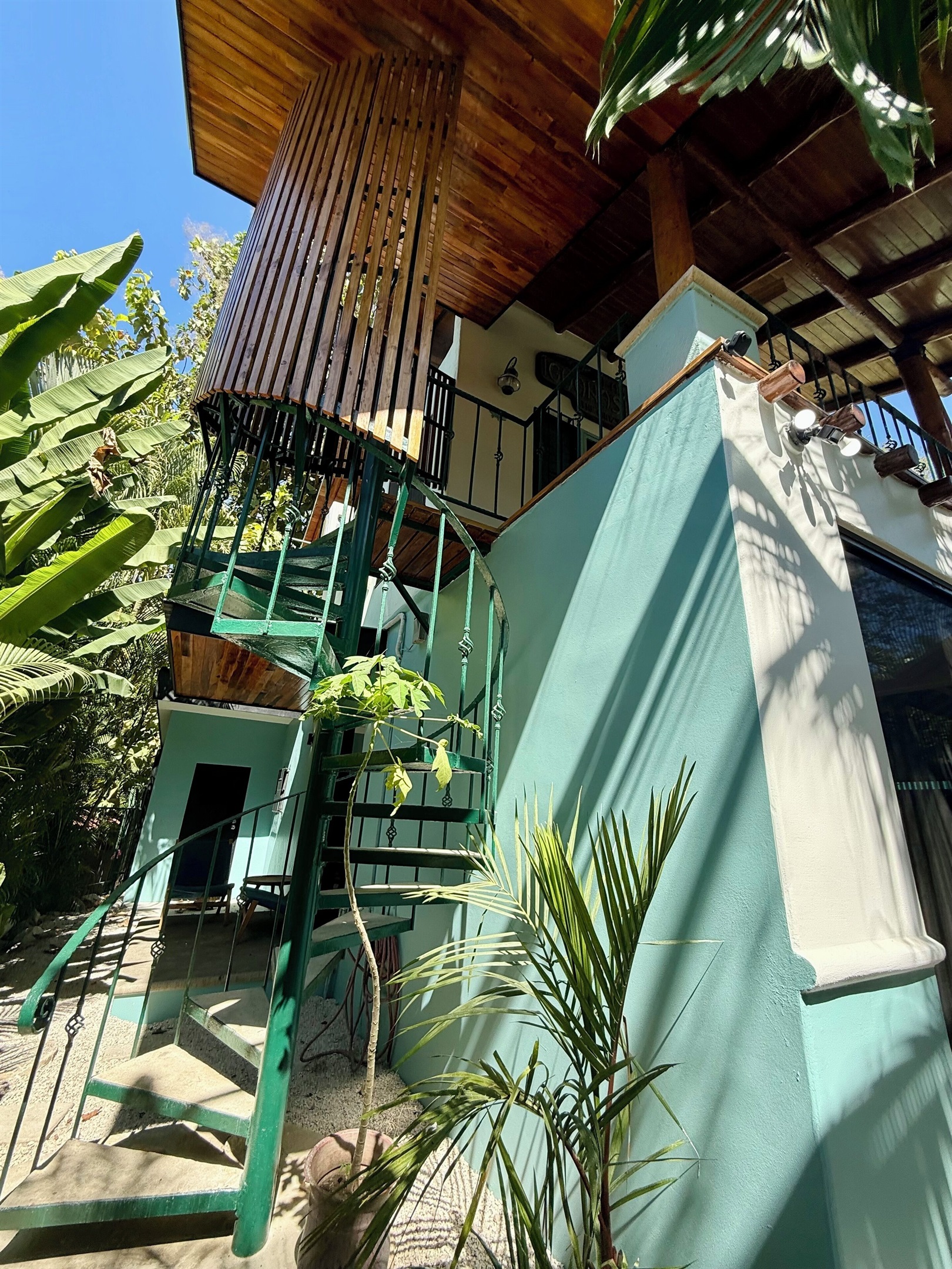 Exterior covered spiral staircase for upstairs bedroom 5