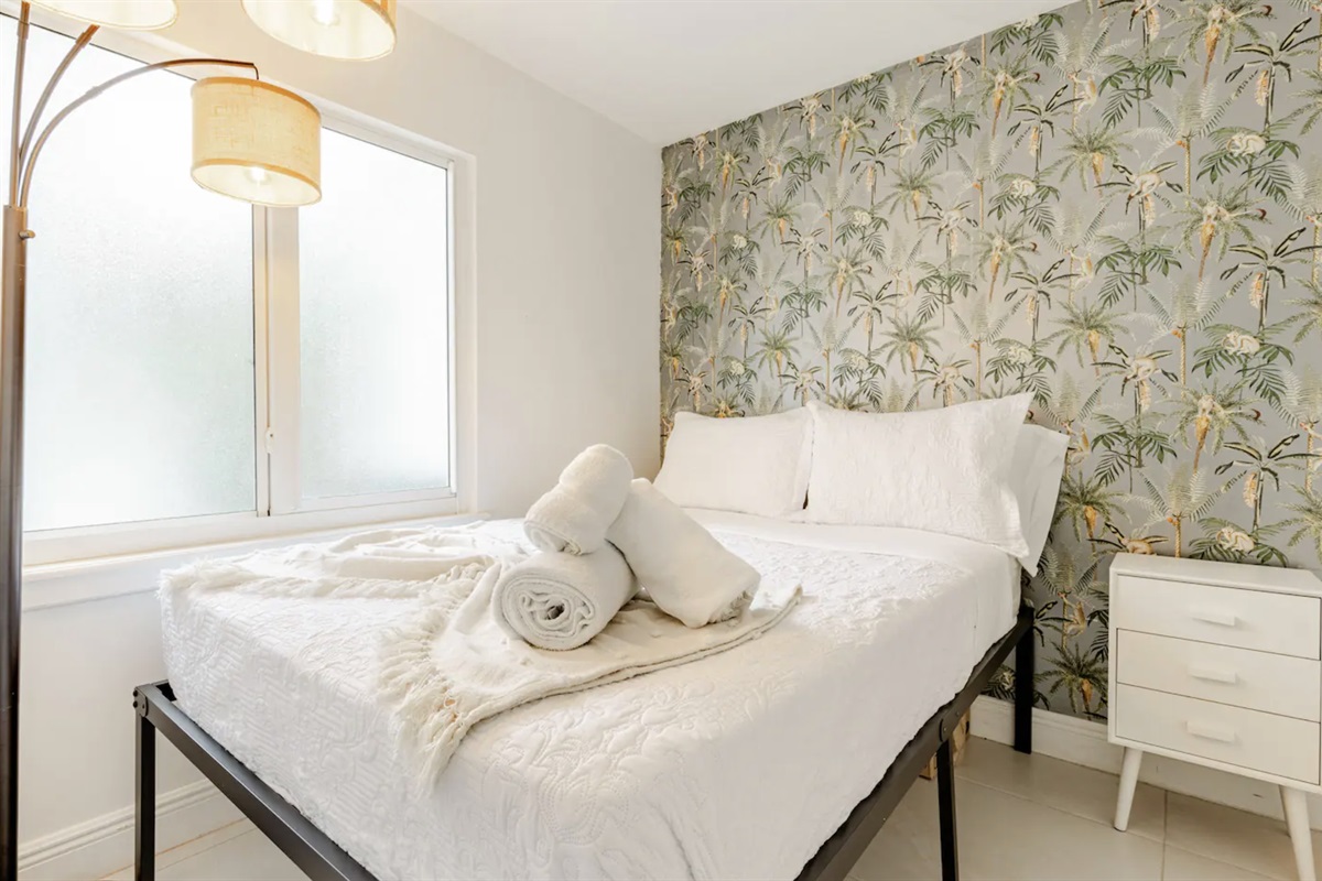 The cozy rear bedroom is our favorite! A tranquil, quiet bedroom that connects through the master bedroom. Families love this room!