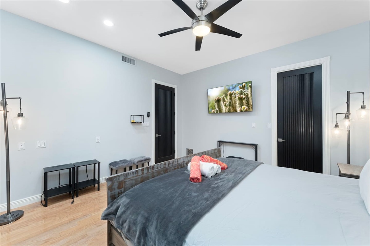 Bright and inviting bedroom with chic décor, natural wood tones, and plush bedding for restful nights.