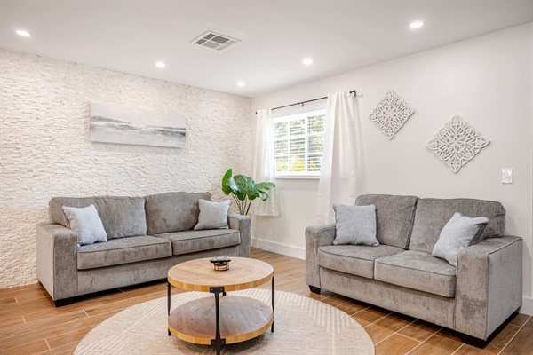 Living room with a queen pull-out sofa and love seat