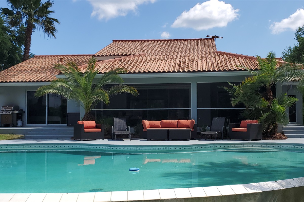 Sunset Cove infinity edge pool and view from backyard