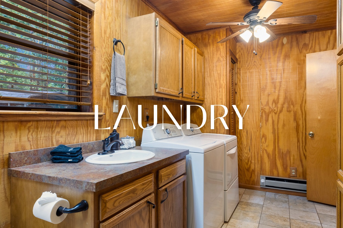 Laundry room with washer and dryer for guest use.