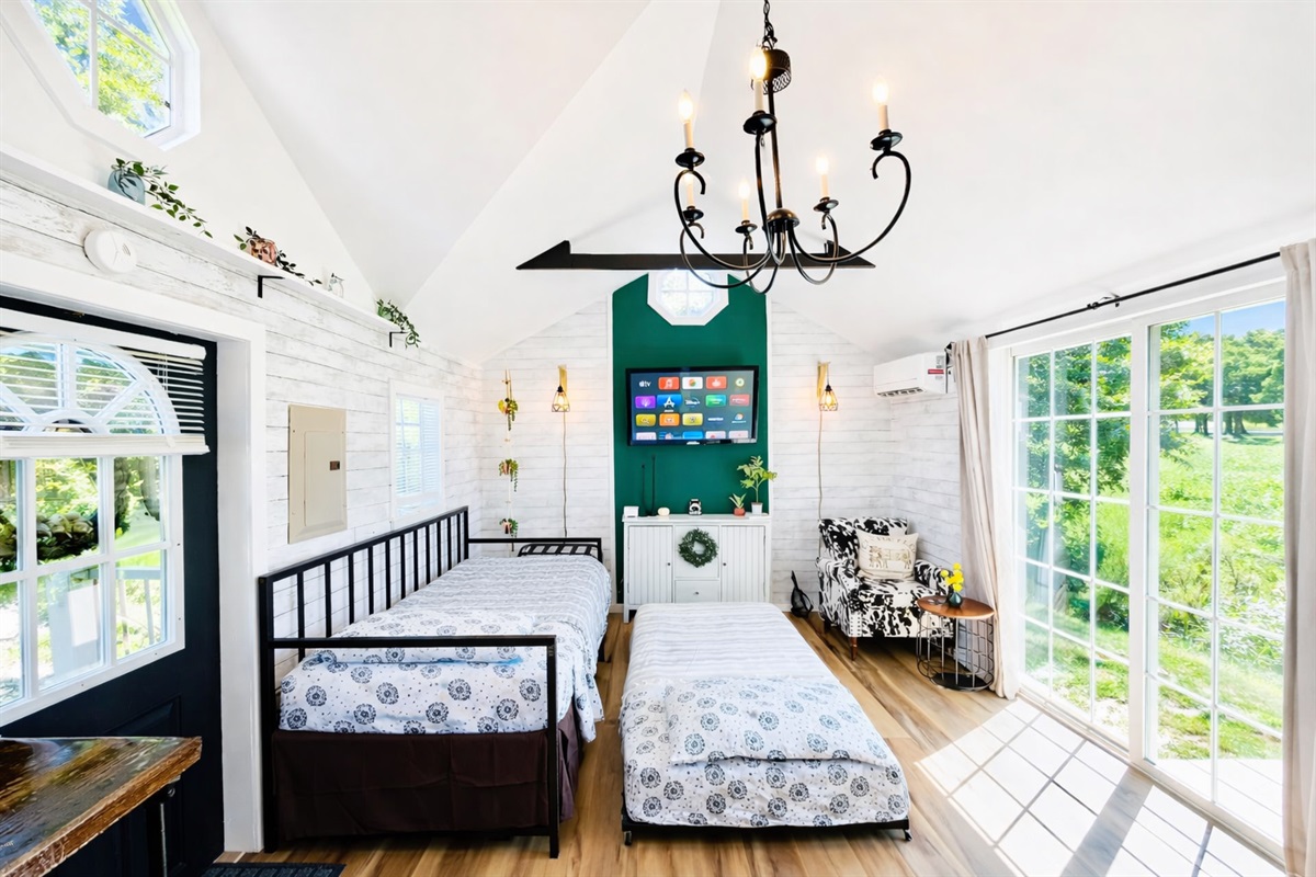 Sleeping arrangements on the first floor include two twin-sized beds. The trundle bed pulls out from under the daybed. All linens are included