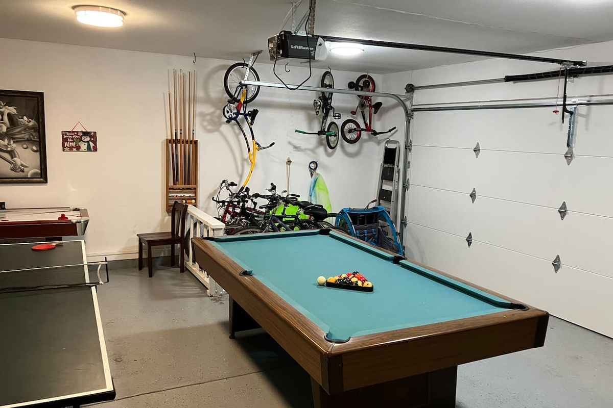 The large, 2-car garage is your bonus room! Ping pong table, pool table, air hockey, couch, and bikes galore!