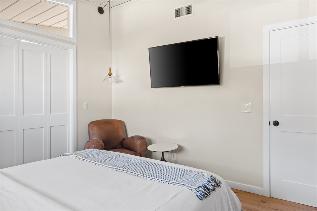 Guest bedroom one off of the living room with doors shut