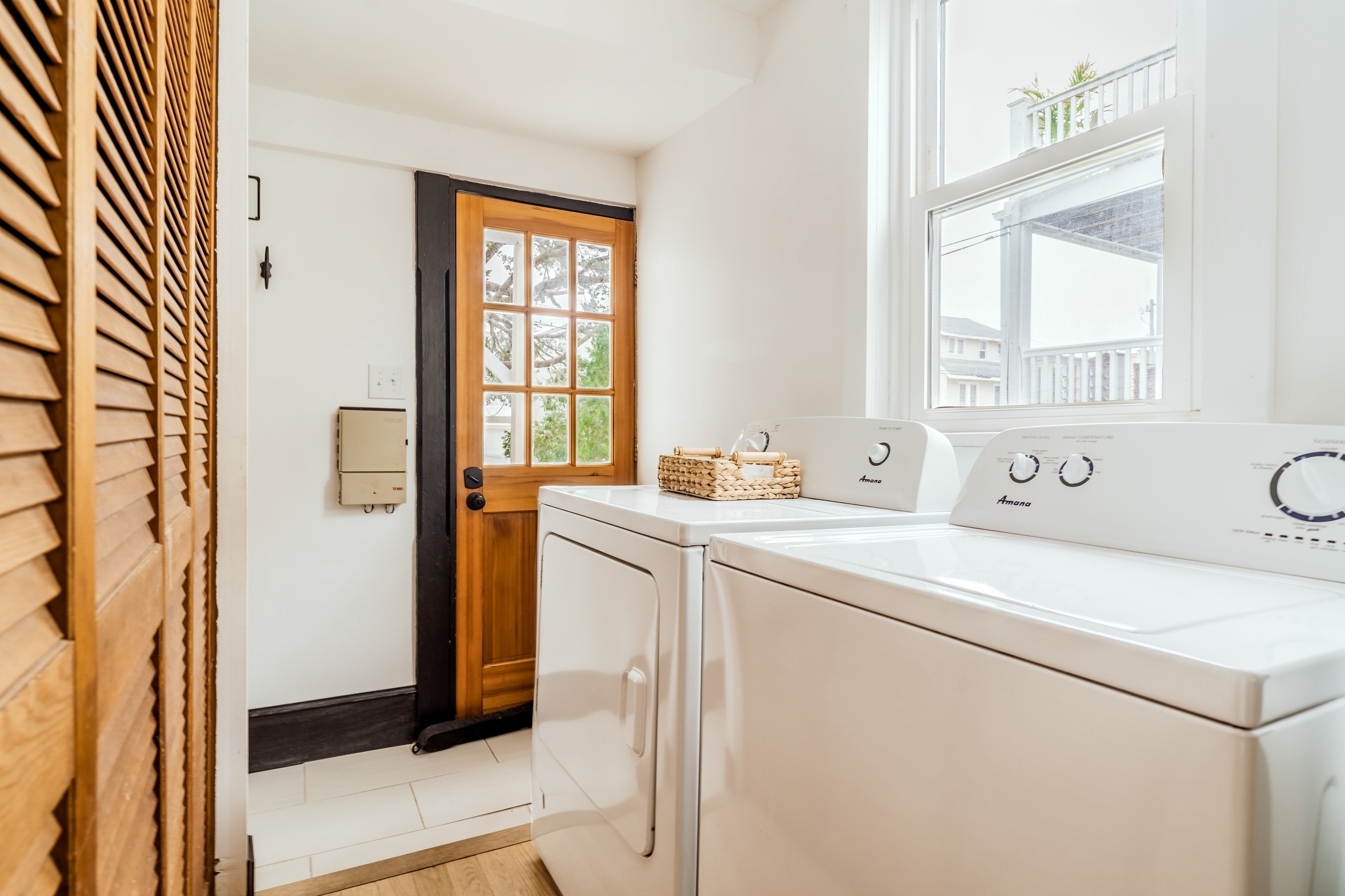 Laundry Area Featuring Top-Loading Washer, Dryer