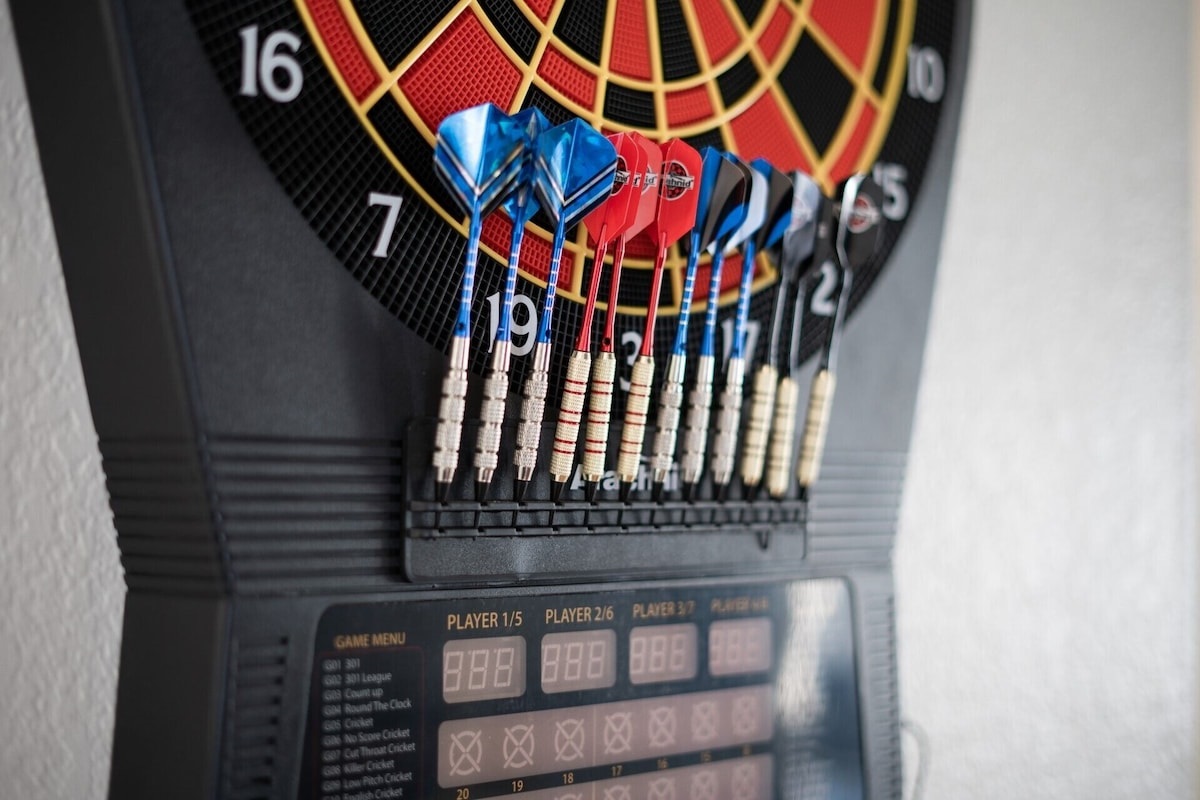 Electronic dart board in game room