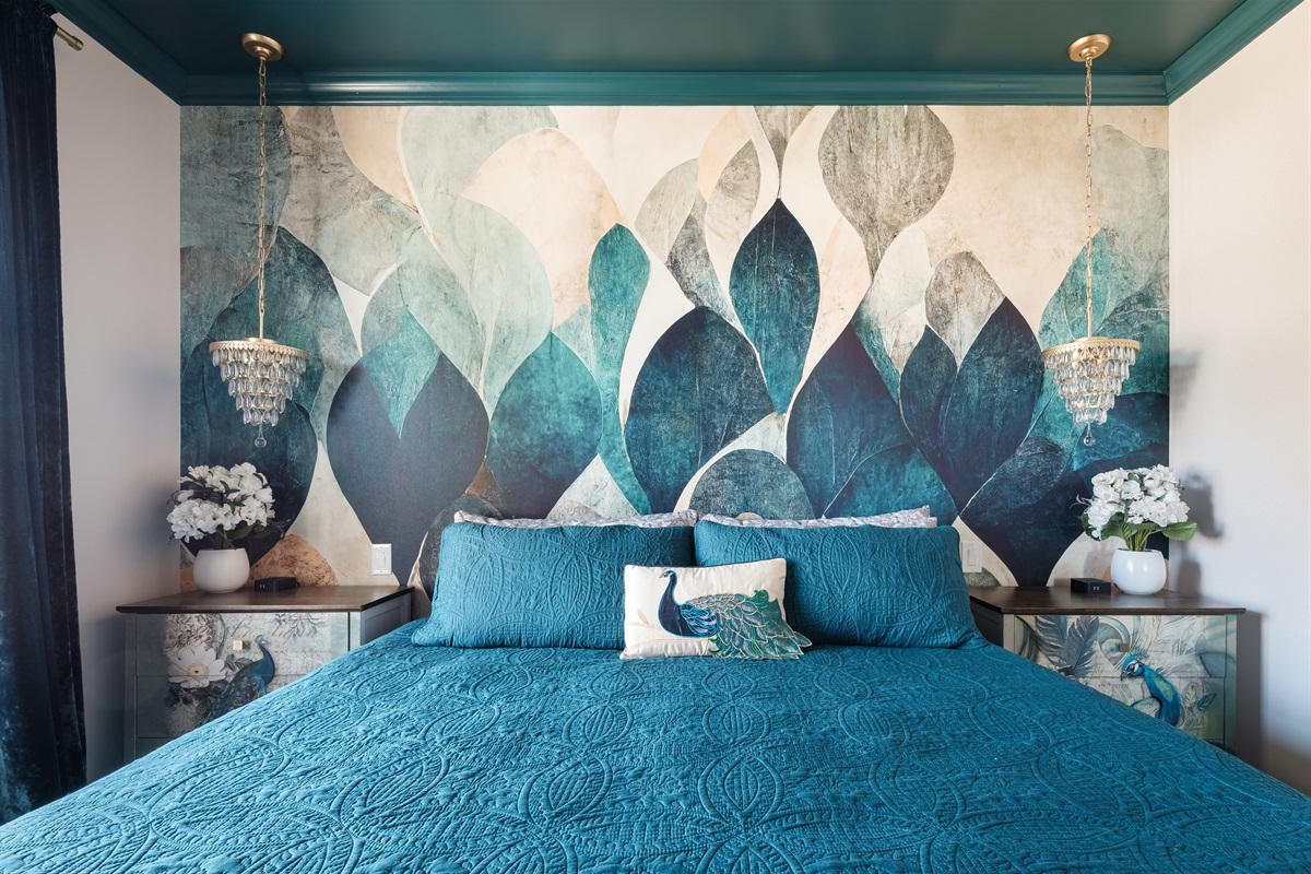 Drift into serenity in this beautiful King bedroom suite designed with rich textures, bold teal tones, and elegant peacock-inspired details.