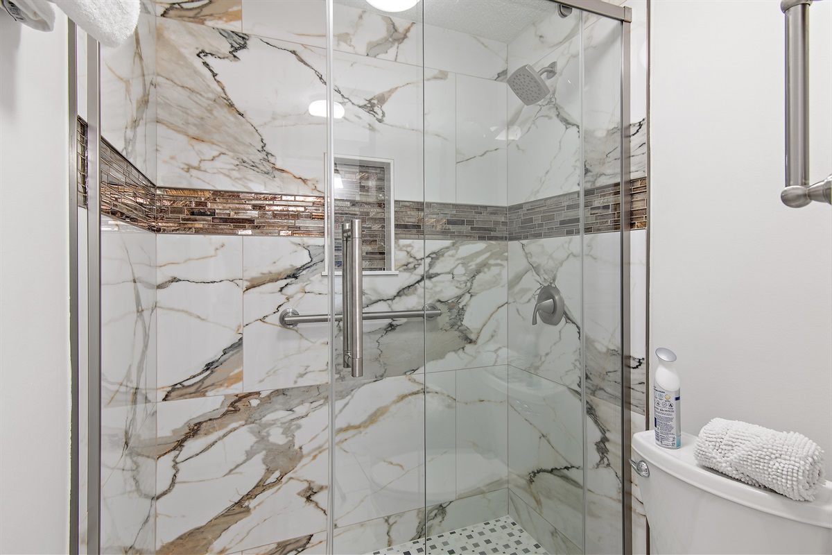 Primary bathroom has granite countertops, dual vanities, and a BRAND NEW Walk in Shower!