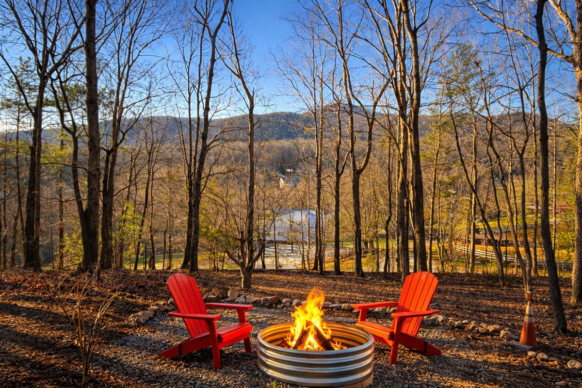 Enjoy mountain evenings by the firepit with Adirondack chairs and peaceful wooded views.