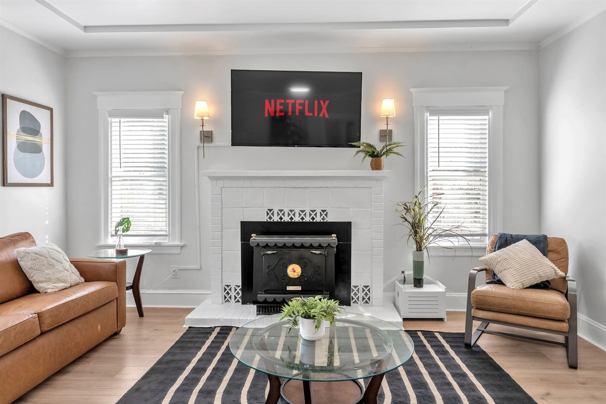 Relax in the spacious living room with stylish furniture and a 65-inch Smart TV—perfect for movie nights or unwinding after a Bay Area adventure.
