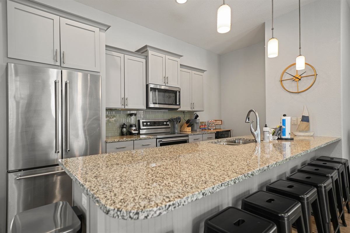 Spacious kitchen island with bar seating—ideal for casual dining and entertaining.