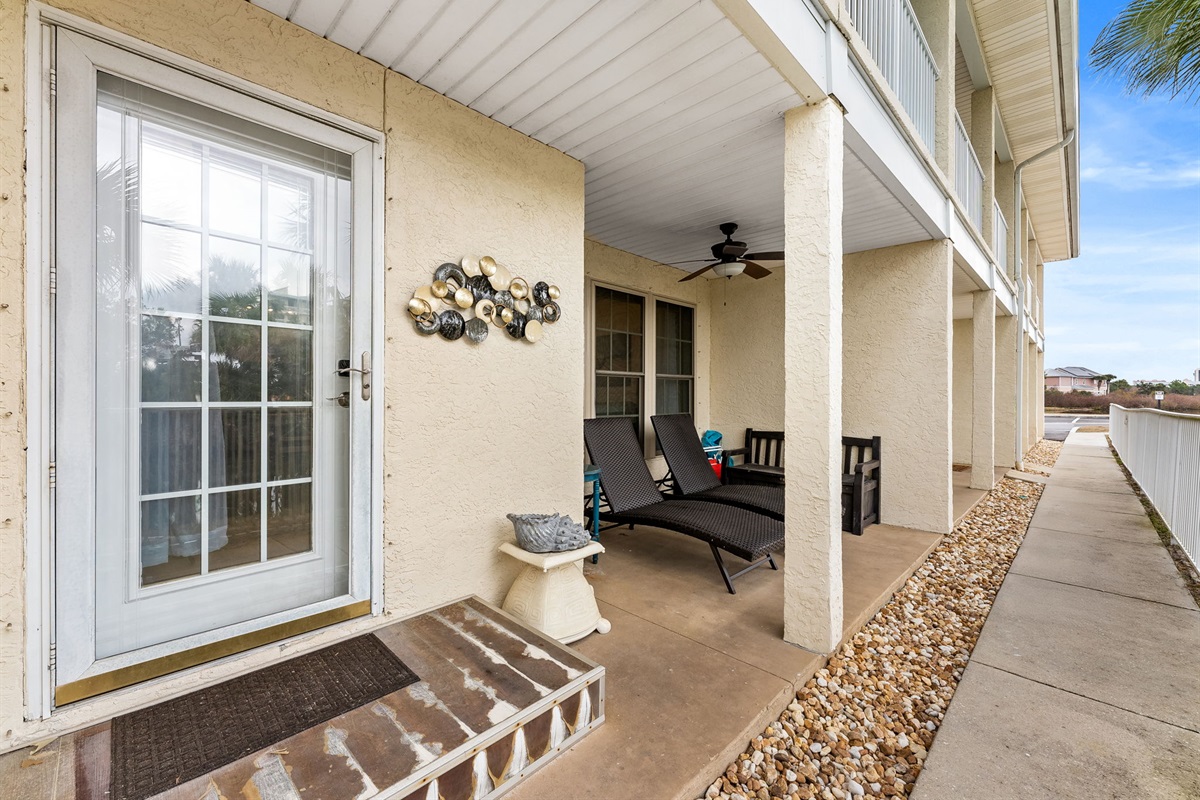 First-floor patio with peaceful lagoon views — perfect for morning coffee or evening unwinding. Quick, easy 2-minute stroll to beach access via sidewalk right out of your back door!