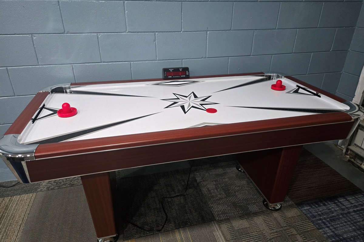 Air hockey in game room