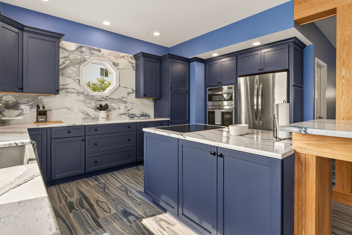 Full kitchen with island and stainless appliances
