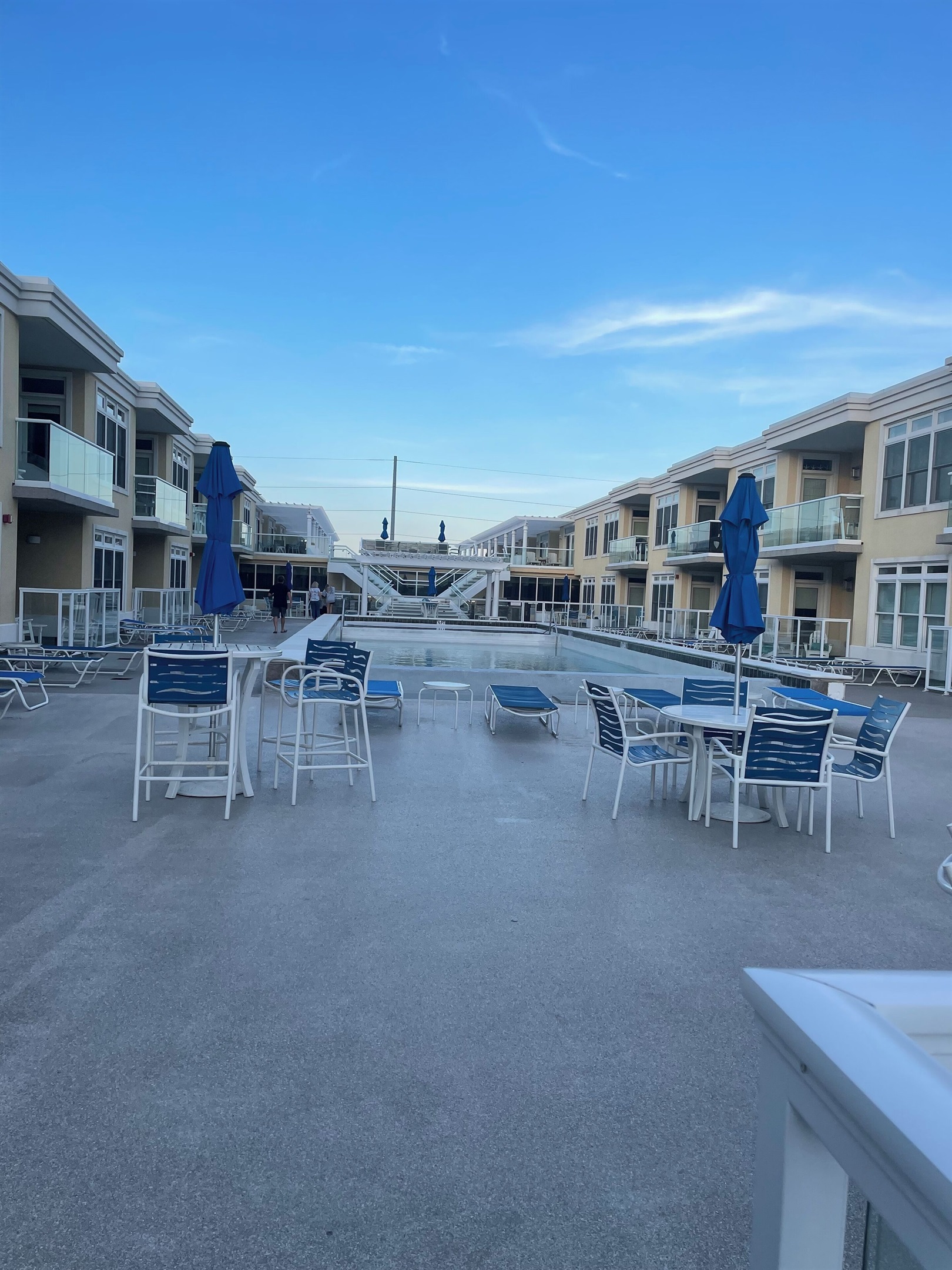 Shared rooftop space with grills, fire pits overlooking bay