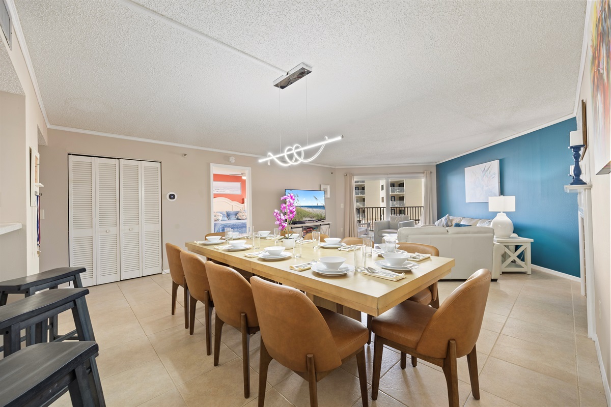 Dining room table seats 10 plus 3 additional bar stools.