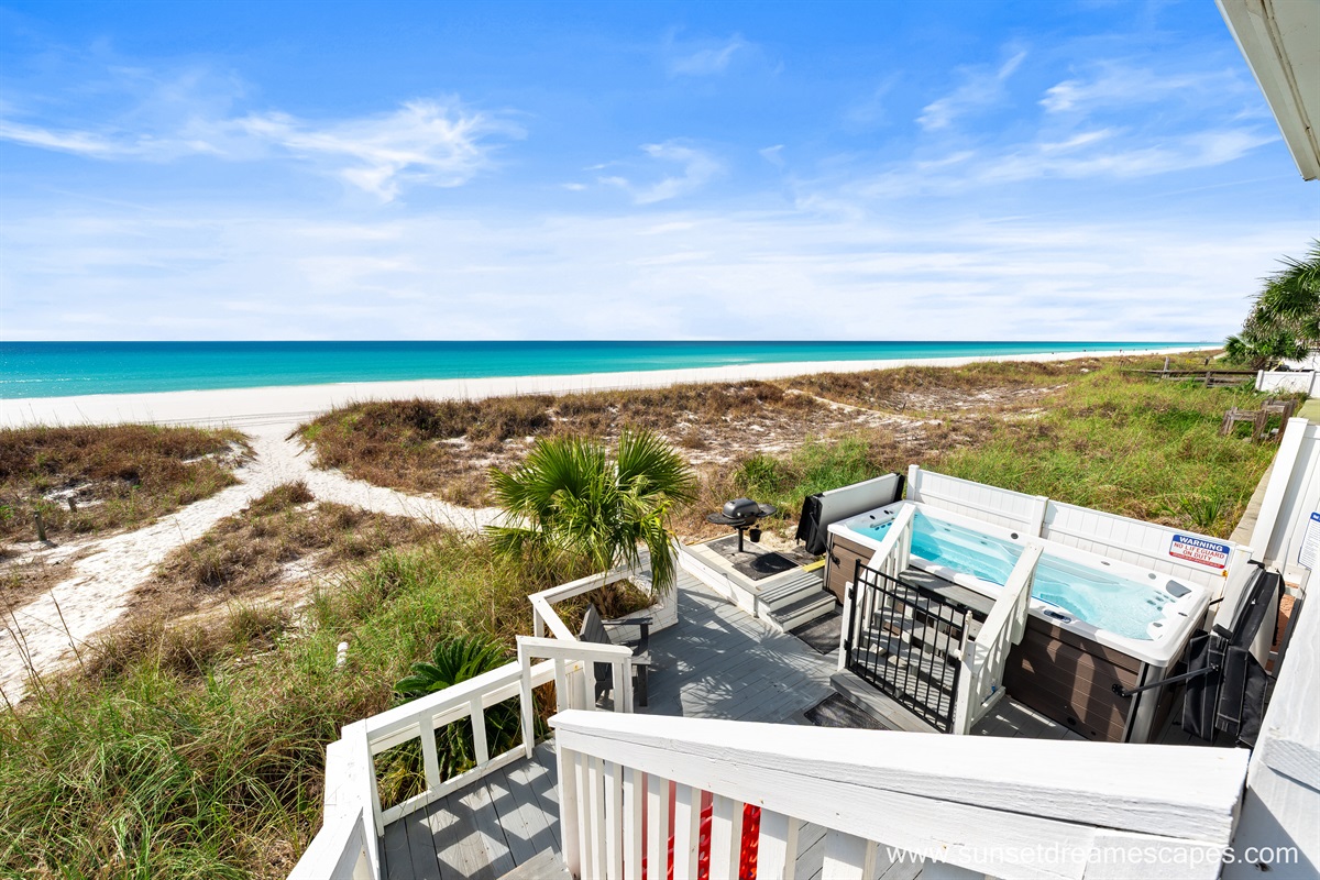 While the Upper deck has two dining tables, the lower deck has four lounge chairs, couches, and a game table along with outdoor over-sized Connect Four game, swim spa and a park style grill