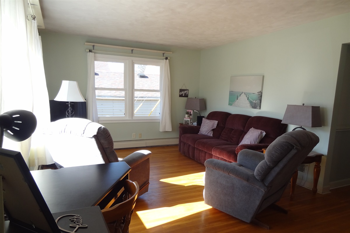 Full size couch, 2 recliners, Roku smart TV, laptop work space