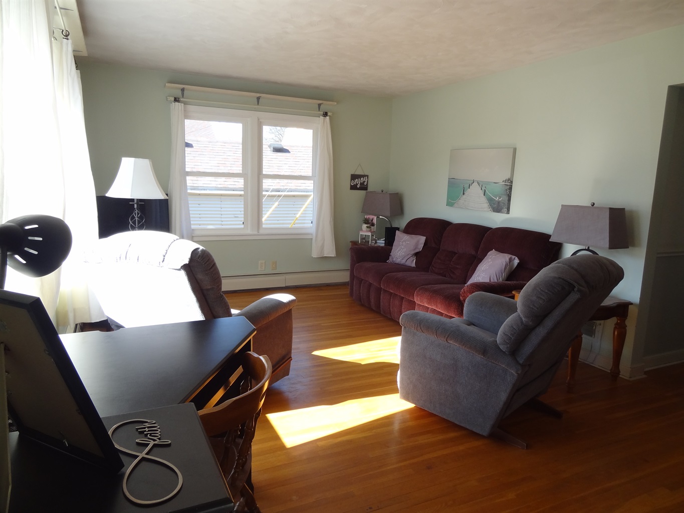 Full size couch, 2 recliners, Roku smart TV, laptop work space