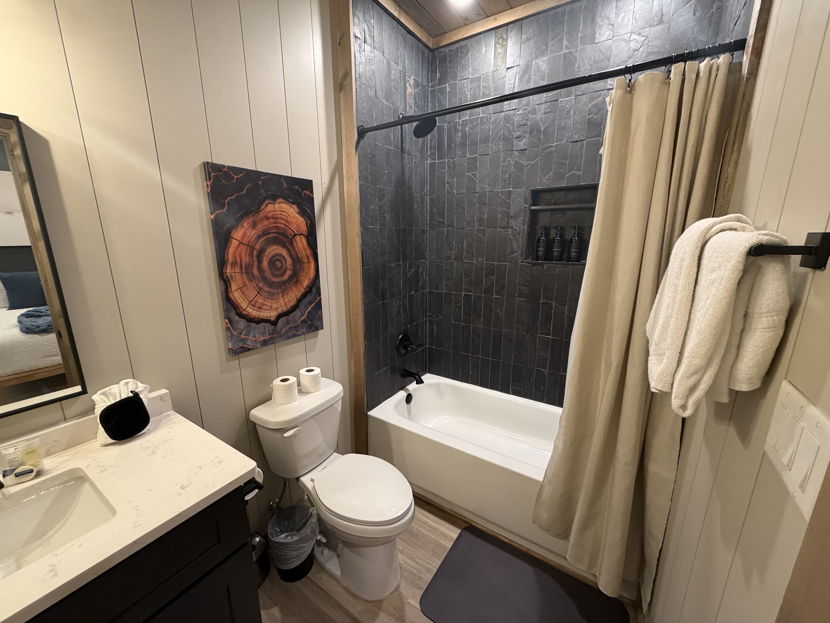 Second King en-suite bathroom downstairs with shower/tub combo