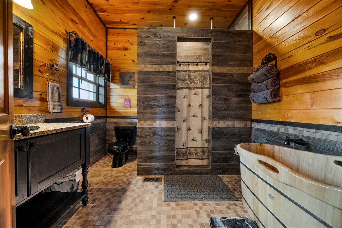 The first floor bath is the biggest bath. It has the soaking tub, large 2 person shower with dual shower heads and large vanity. All vanities are furniture quality. Makeup mirror and hair dryer under the sink too.