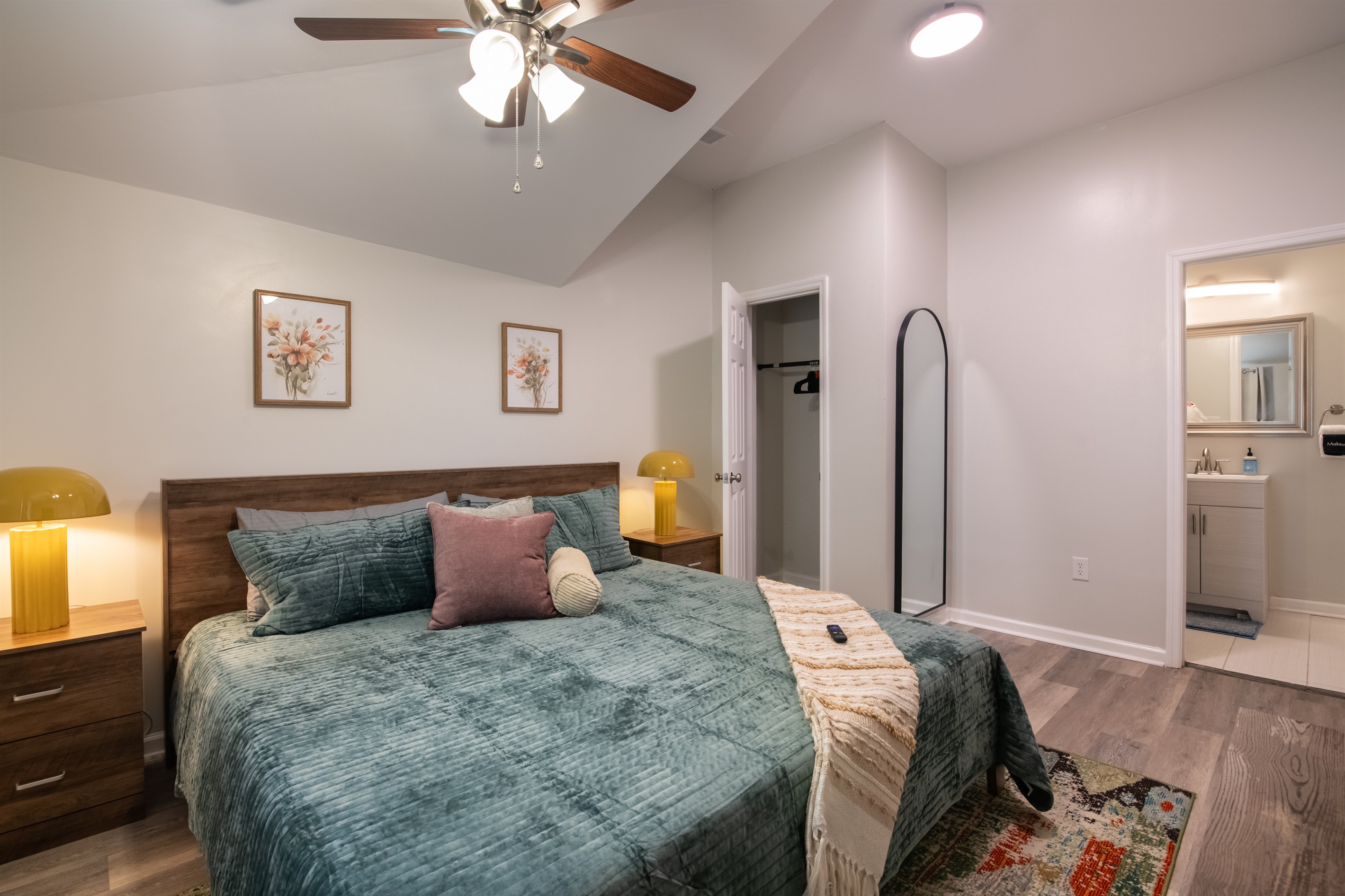 A beautifully lit bedroom where comfort meets style.